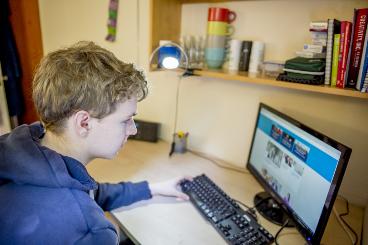 Undergraduate student studying in bedroom at Ancaster Hall, University Park