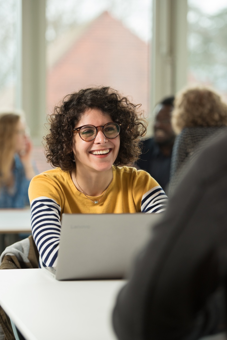 Postgraduate student using laptop