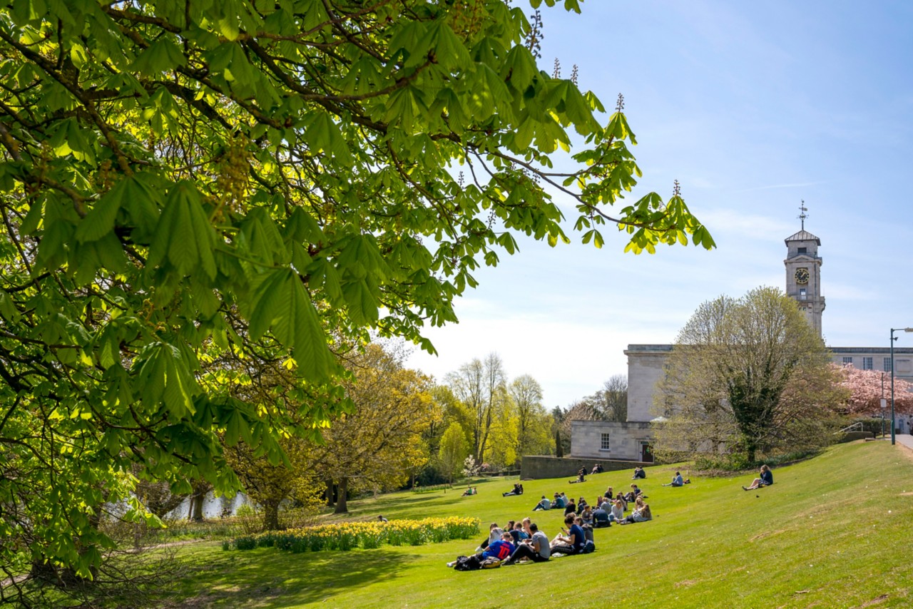 Students enjoying summer on University Park, next to Trent Building