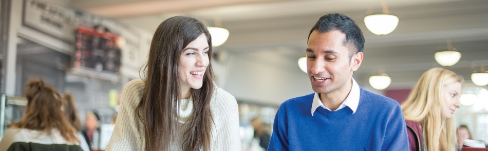 Two postgraduate students studying