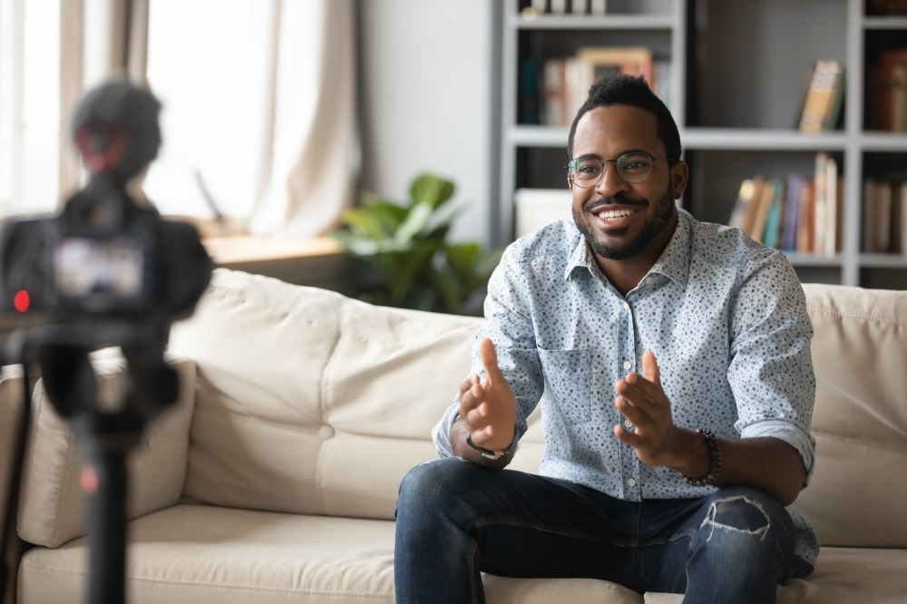 An image of a man recording educational video webinar
