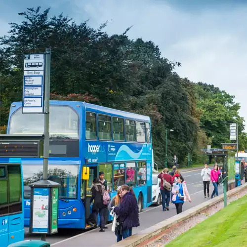 University hopper bus collecting students and staff from University Park