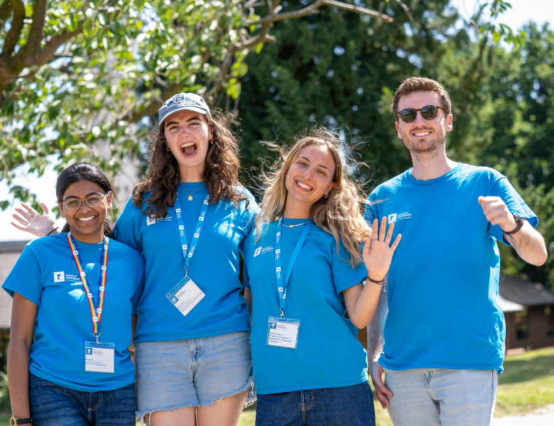 Four student Open Day helpers smiling at the camera
