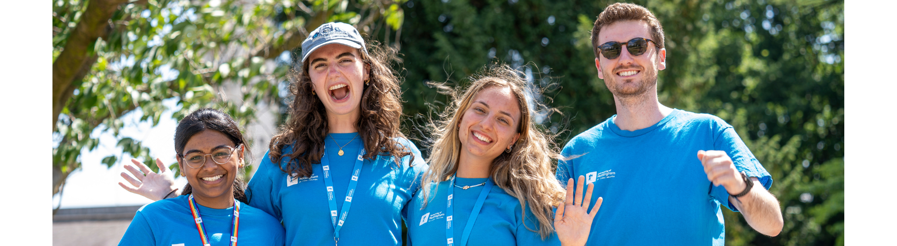 Four student Open Day helpers smiling at the camera